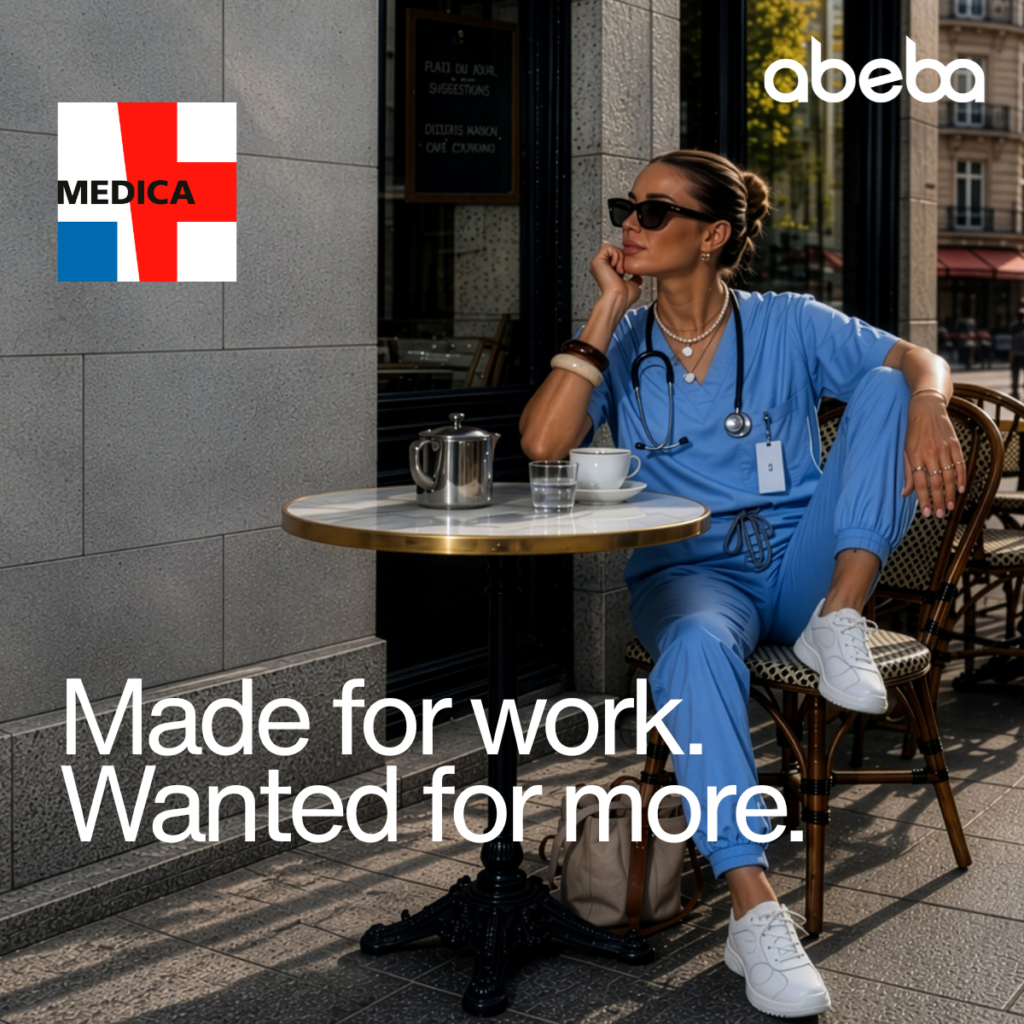 A nurse in blue work clothes and white work shoes