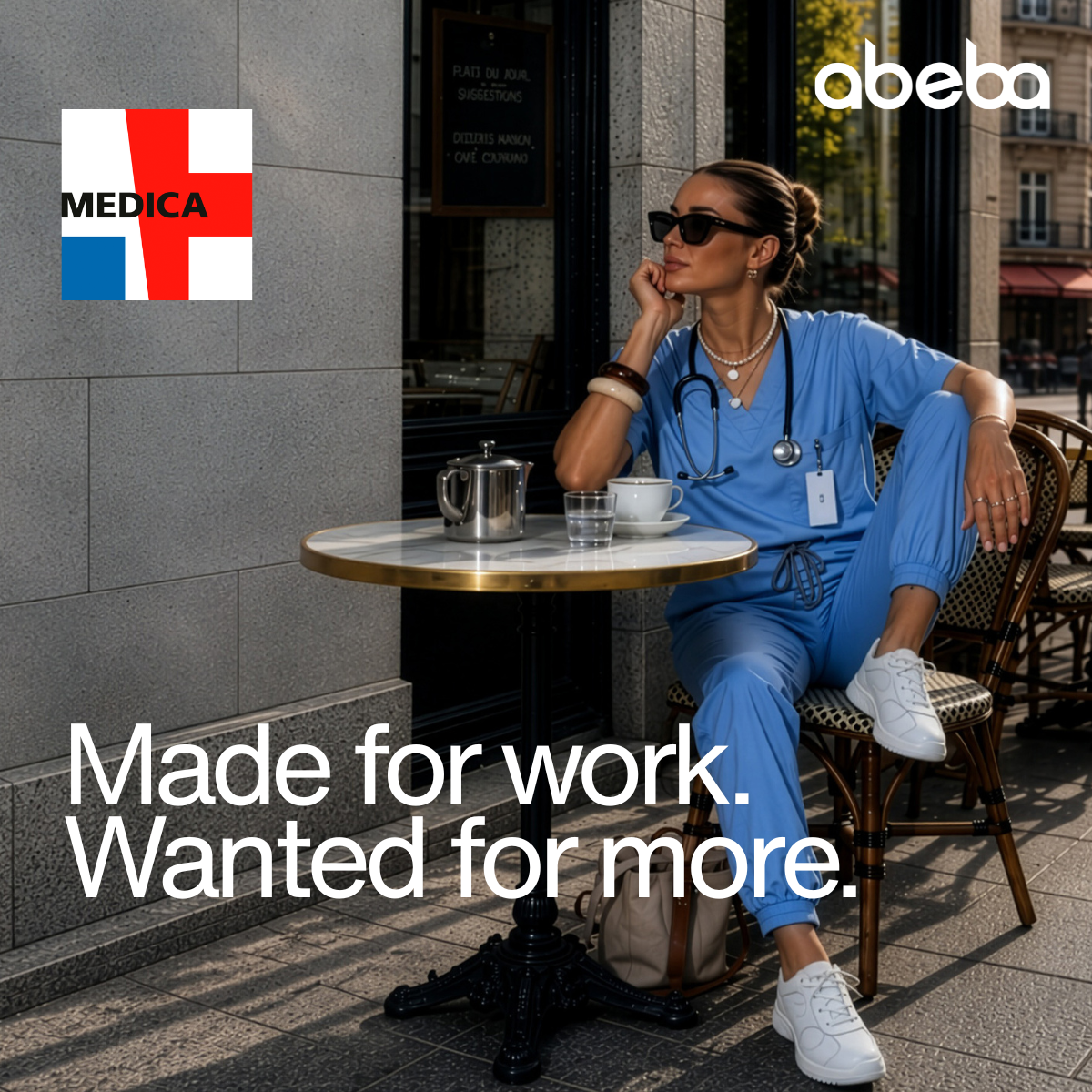 A nurse in blue work clothes and white work shoes